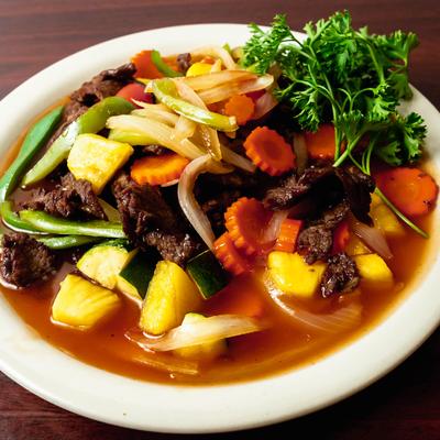 Stir-fried beef chunks, with pineapple, vegetables, and sweet and sour sauce.